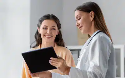 doctor with patient looking at tablet